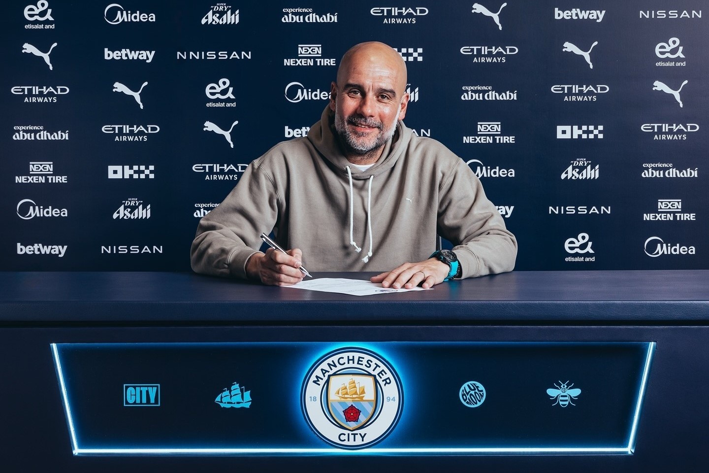 Guardiola extends stay as Manchester City boss