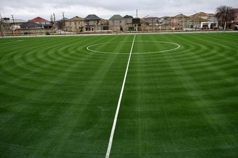 Binə stadionunun ot örtüyü yenilənib - FOTO