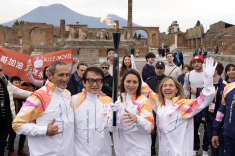 Jackie Chan takes part in Olympic torch relay ahead of Milan Winter Games