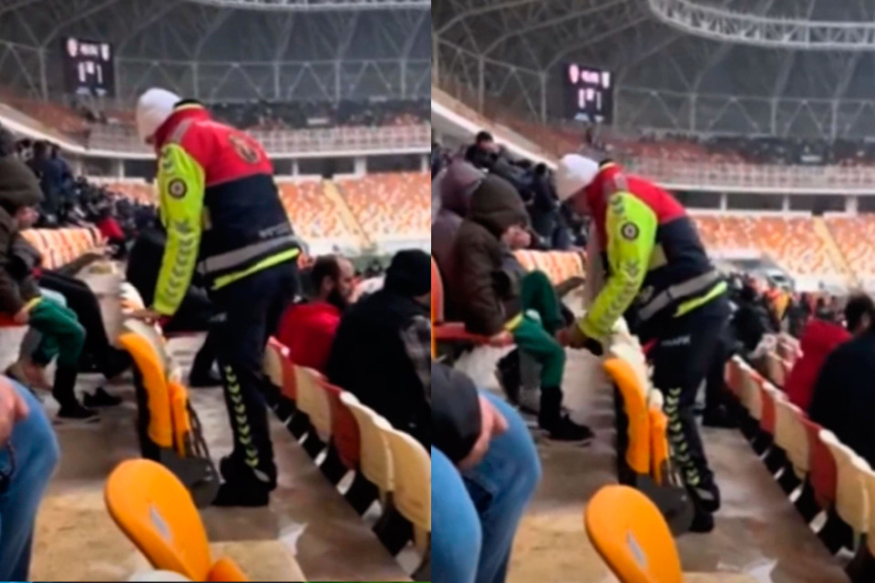 Polis stadionda üşüyən uşağa corabını verdi - VİDEO