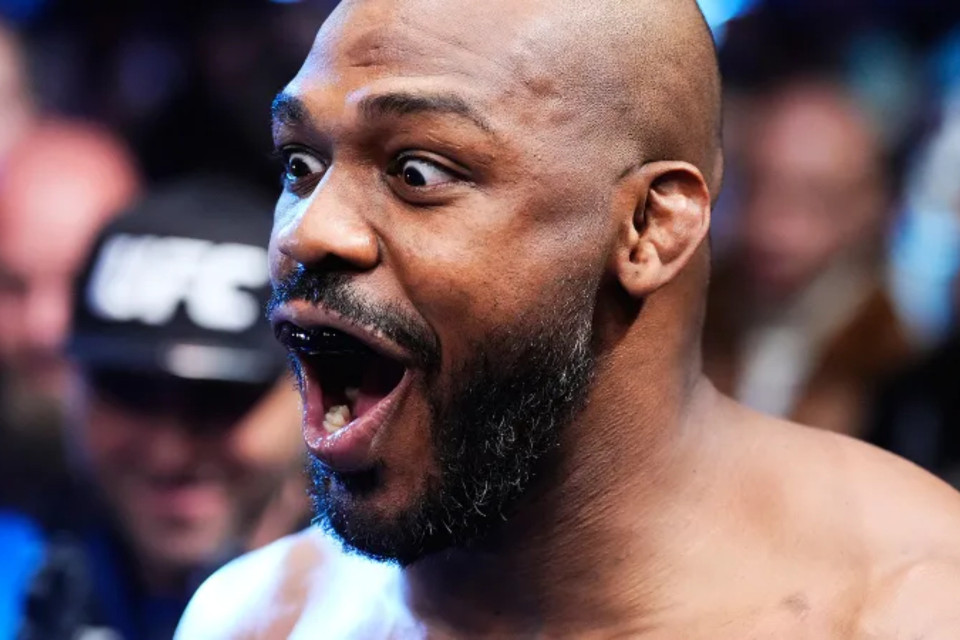Jon Jones reacts in surprise as fan unveils full-leg tattoo tribute - VIDEO